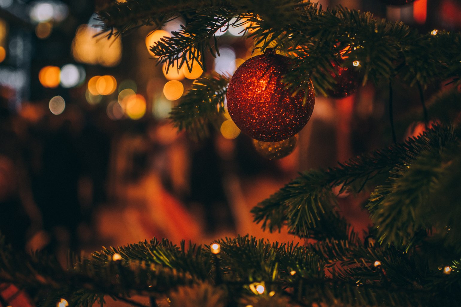 Christmas tree and close up of a red bauble