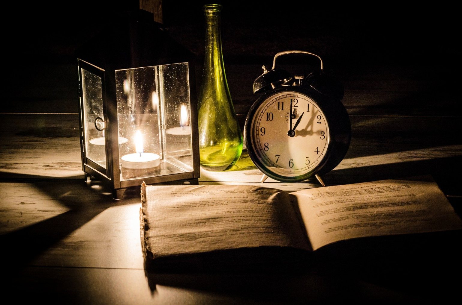 Circadian Rhythm - Reading Book and alarm clock by candle lamplight