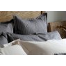 Pair of Charcoal grey St. Leger pinstripe cotton pillowcases neatly arranged on bed.
