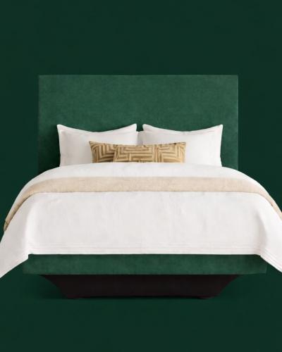 The Freya Bed with floating base, upholstered in Plush Conifer. Discover the Signature Collection and...
