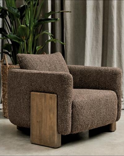Minimalist form. Maximum impact. Expertly upholstered in luxuriously textured bouclé the Vespucci Ar...